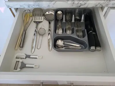 a drawer filled with utensils in a kitchen at Kloudscape Apartman Milmari Resort & Spa in Kopaonik