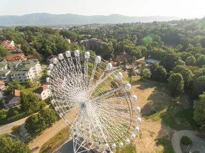 an overhead view of a ferris wheel in a city at Woody apartman in Vrnjačka Banja