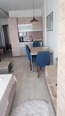 a kitchen and dining room with a table and chairs at Milmari M3A in Kopaonik