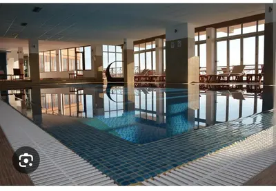 a large swimming pool in a large building at Milmari M3A in Kopaonik
