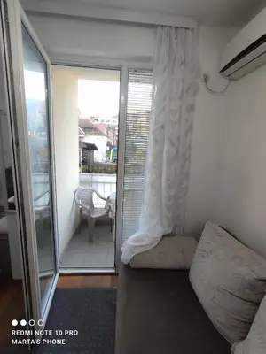 a room with a balcony with a bed and a balcony at Marta i Marija in Vrnjačka Banja