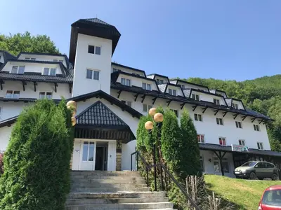 a building with stairs in front of it at Planinski Raj - Bela Reka Gondola in Brzeće