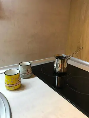 two pots and pans sitting on top of a stove at Planinski Raj - Bela Reka Gondola in Brzeće