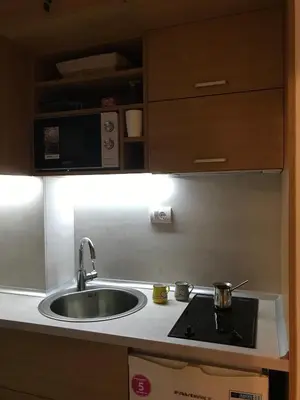 a kitchen with a sink and a microwave at Planinski Raj - Bela Reka Gondola in Brzeće