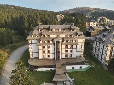 an aerial view of a building on a hill at ZIMSKI Apartmani in Kopaonik