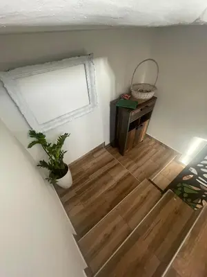 a room with a window and a wooden floor at Temački konaci in Pirot
