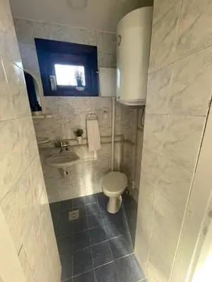 a bathroom with a toilet and a sink at Temački konaci in Pirot