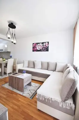 a living room with a couch and a table at Apartman Filipović Vrnjačka Banja in Vrnjačka Banja