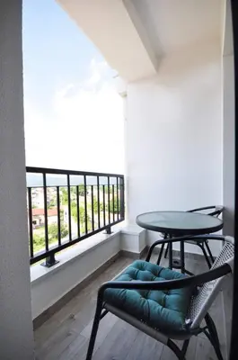 a table and chairs in a room with a window at Apartman Filipović Vrnjačka Banja in Vrnjačka Banja