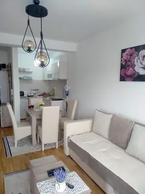 a living room with a couch and a table at Apartman Filipović Vrnjačka Banja in Vrnjačka Banja