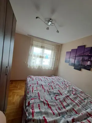 a bedroom with a bed and a window at MAŠA Apartman Vrnjacka Banja in Vrnjačka Banja