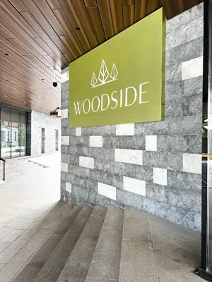 a woodside sign on the side of a building at Woodside 007 in Kopaonik