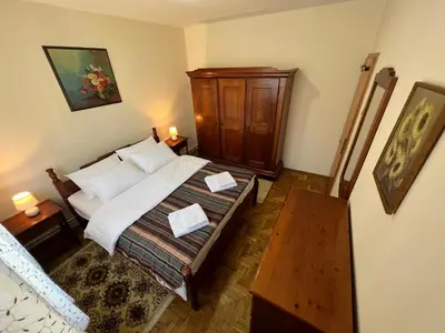 a bedroom with a bed with two papers on it at InterInn Luxury Villa in Paraćin