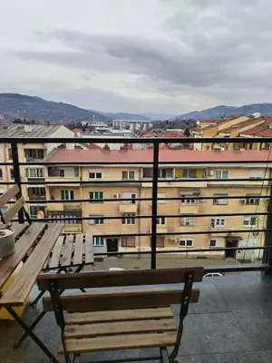 a bench sitting on the roof of a building at Apartman Nika in Pirot