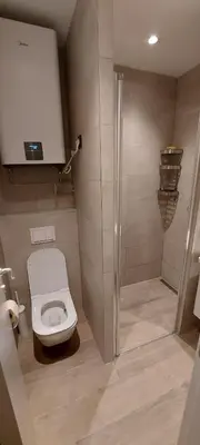 a bathroom with a toilet and a shower at PAHULJA Vila Bela Reka Kopaonik Brzeće in Brzeće