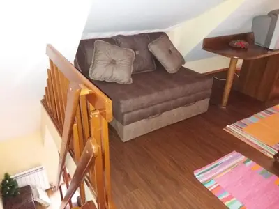 a living room with a couch in a room at JollyKop Vila Valentina A14 in Kopaonik