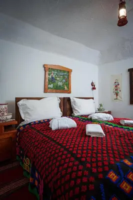 a bedroom with a bed with two pillows on it at Eko Zaseok Brana in Rekovac