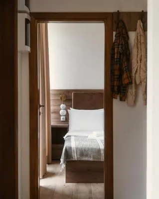 a bedroom with a bed and a table with a mirror at Eko Zaseok Brana in Rekovac