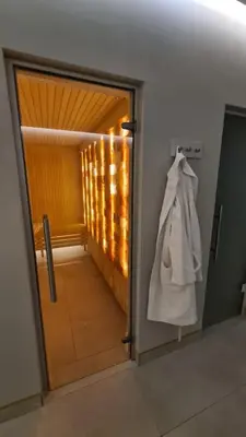 an open door with a white bag hanging on a wall at DolceVita Lux & SPA in Vrnjačka Banja