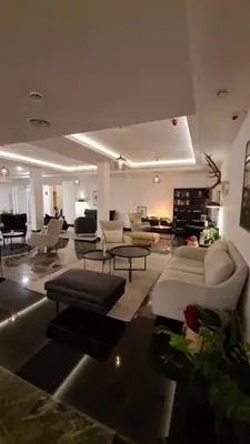 a large living room with couches and tables at DolceVita Lux & SPA in Vrnjačka Banja