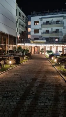 an empty street in front of a building at night at DolceVita Lux & SPA in Vrnjačka Banja