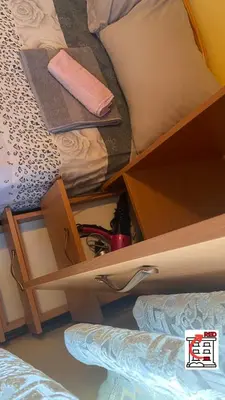 a bedroom with a bunk bed with an open drawer at Apartman RED u Vrnjačkoj Banji in Vrnjačka Banja