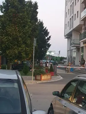 a street with cars parked on the side of the road at Apartman N Jagodina in Jagodina