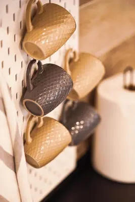 a group of woodenagonalagonalagonalagonal shoes hanging on a wall at Tontic Lux Milmari in Kopaonik