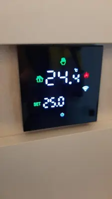 a digital clock on a wall with at Tontic Lux Residence Hill 53 in Kopaonik