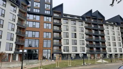 a large apartment building with a lot of windows at Tontic Lux Residence Hill 53 in Kopaonik