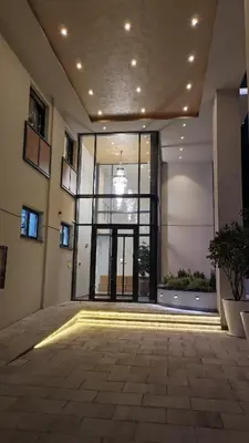 a large room with a large window in a building at Lux Apartman Crnjanski IV, Jagodina in Jagodina
