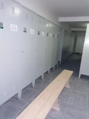 a row of lockers in a room with a wooden floor at Apartman Zvončica 29 in Kopaonik