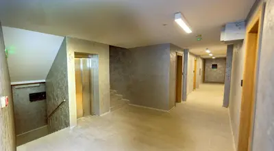 an empty hallway with stairs in a building at Vila Bela reka in Brzeće
