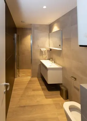 a bathroom with a sink and a toilet at Vila Bela reka in Brzeće