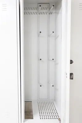 a white walk in shower with glass doors at Vila Bela reka in Brzeće
