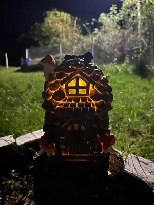 a toy turtle is sitting in the grass at Vila Vida in Kruševac
