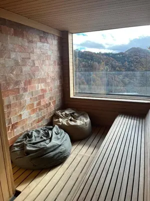 two bean bags in a room with a large window at Apartman Staša Zoned II in Kopaonik