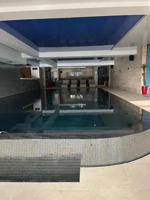 a large swimming pool in a building at Apartman Staša Zoned II in Kopaonik