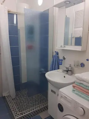 a bathroom with a shower and a sink at Apartman Oskar in Bor