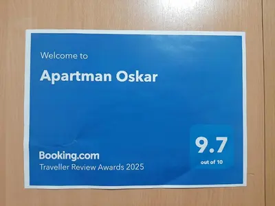 a blue sign on the door of an elevator at Apartman Oskar in Bor