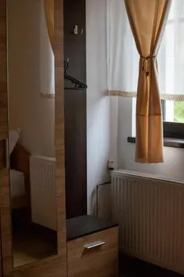 a shower in a bathroom with a glass door at Konačište Zaplanjsko ognjište in Donji Dušnik