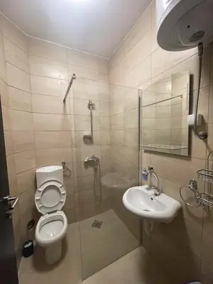 a bathroom with a toilet and a sink at Konačište Zaplanjsko ognjište in Donji Dušnik