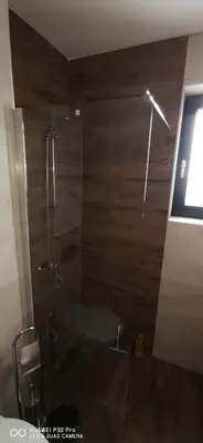 a bathroom with a shower with a toilet in it at Apartman Andjelkovic in Soko Banja