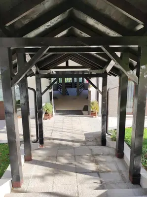 a large concrete structure with two potted plants at Gondola Studio Brzeće Kopaonik in Brzeće