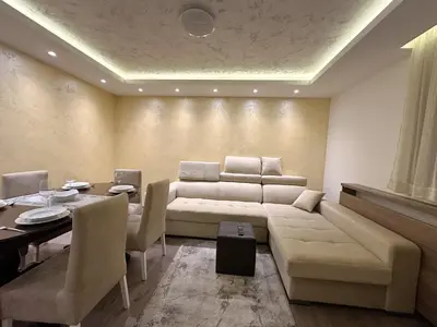 a living room with a couch and a table at MB Apartmani Kopaonik in Kopaonik