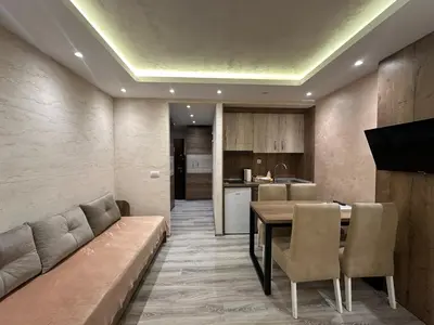 a living room with a couch and a table at MB Apartmani Kopaonik in Kopaonik