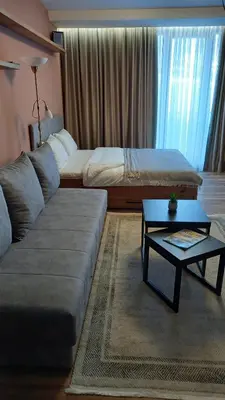a living room with a couch and a coffee table at Apartman MK Kopaonik in Kopaonik