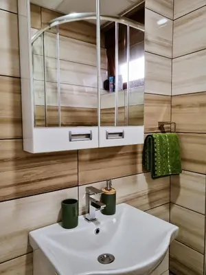 a bathroom with a sink and a mirror at Apartman Nevena in Vrnjačka Banja