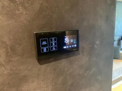 a digital clock on a wall in a room at Woodside Kopaonik - Malo jezero, FREE Parking & SPA in Kopaonik