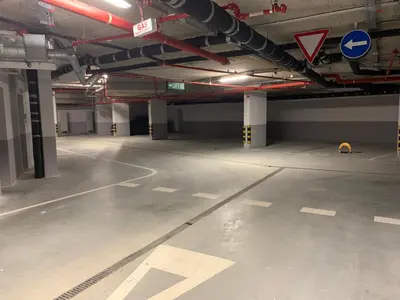 an empty parking lot in a parking garage at Woodside Kopaonik - Malo jezero, FREE Parking & SPA in Kopaonik